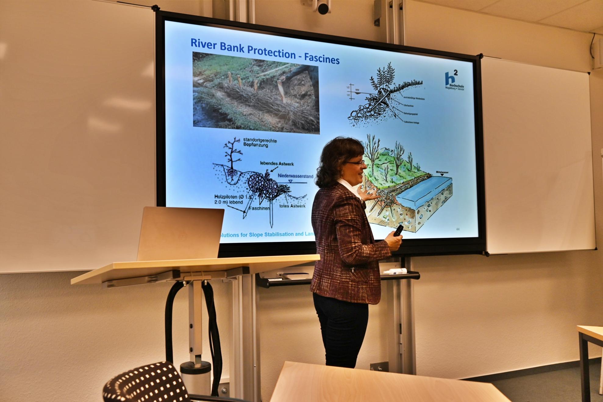 Prof Petra Schneider demonstrates nature-based solutions for stabilising slopes and reducing the risk of landslides.