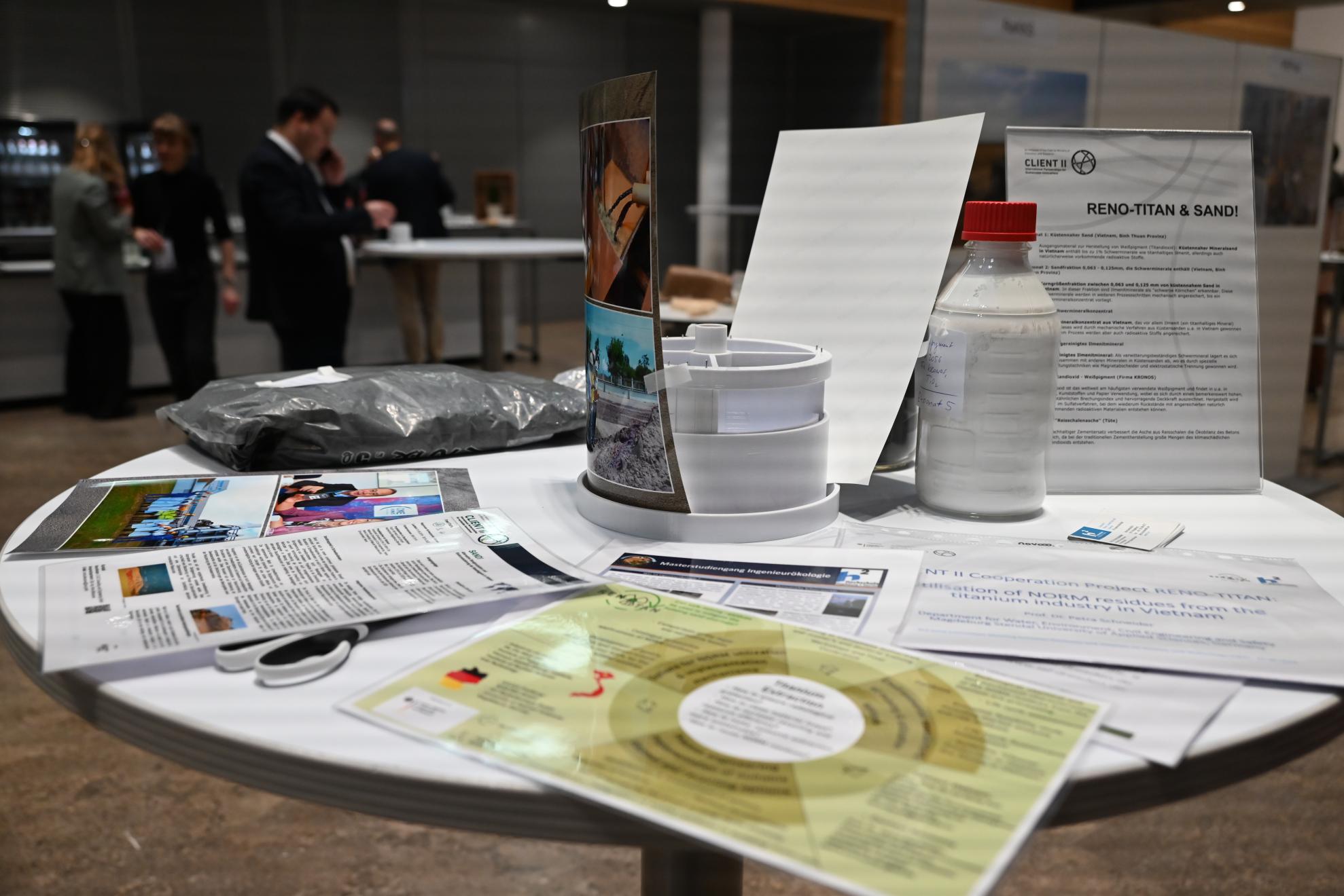 The Magdeburg-Stendal University of Applied Sciences' exhibition stand featuring the current CLIENT II project RENO-TITAN (2023-2026) and its predecessor SAND! (2019-2022)