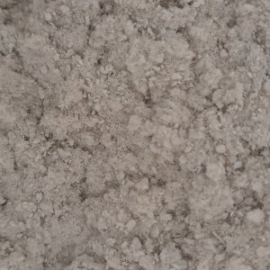 Gypsum fibreboard recycling: Processed gypsum fraction with 80% gypsum content (close-up), here the paper fibres are separated from the gypsum.