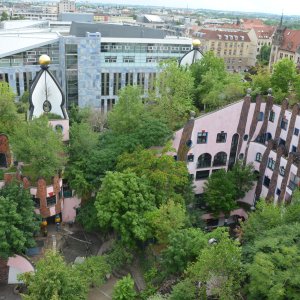 Intensively managed green roofs include larger trees and shrubs, which are mixed with small shrubs and perennials. One example is the Hundertwasserhaus in Magdeburg.