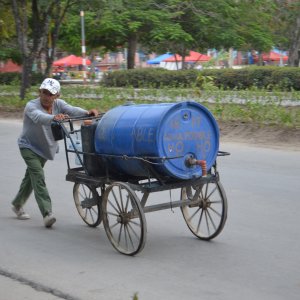 Despite regular rainfall, drinking water is scarce in Cuba. A resident in Holguin collecting water from the central storage facility.